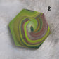 Hexagon shaped epoxy resin piece with swirling greens and rust colored pigments, displayed on a white background. The number "2" is in the top right corner.