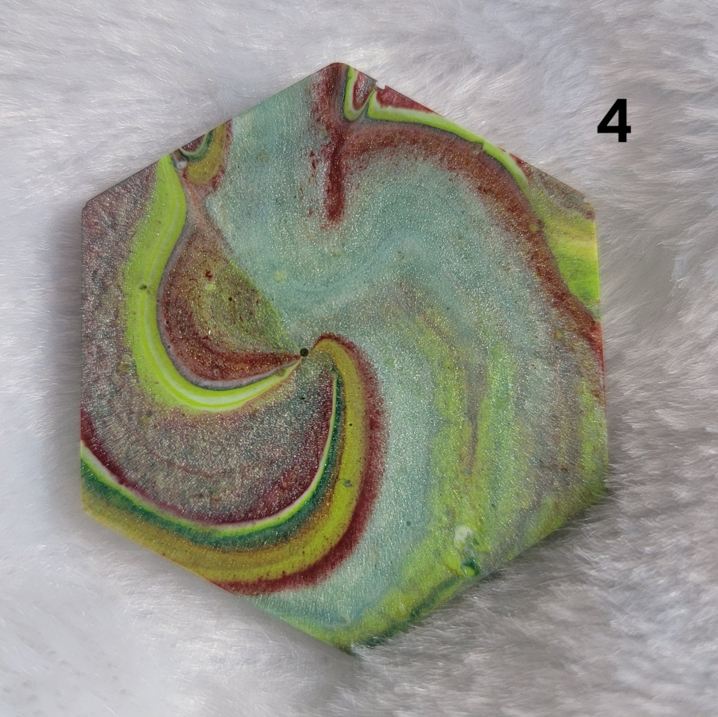 Hexagon shaped epoxy resin piece with swirling greens and rust colored pigments, displayed on a white background. The number "4" is in the top right corner.