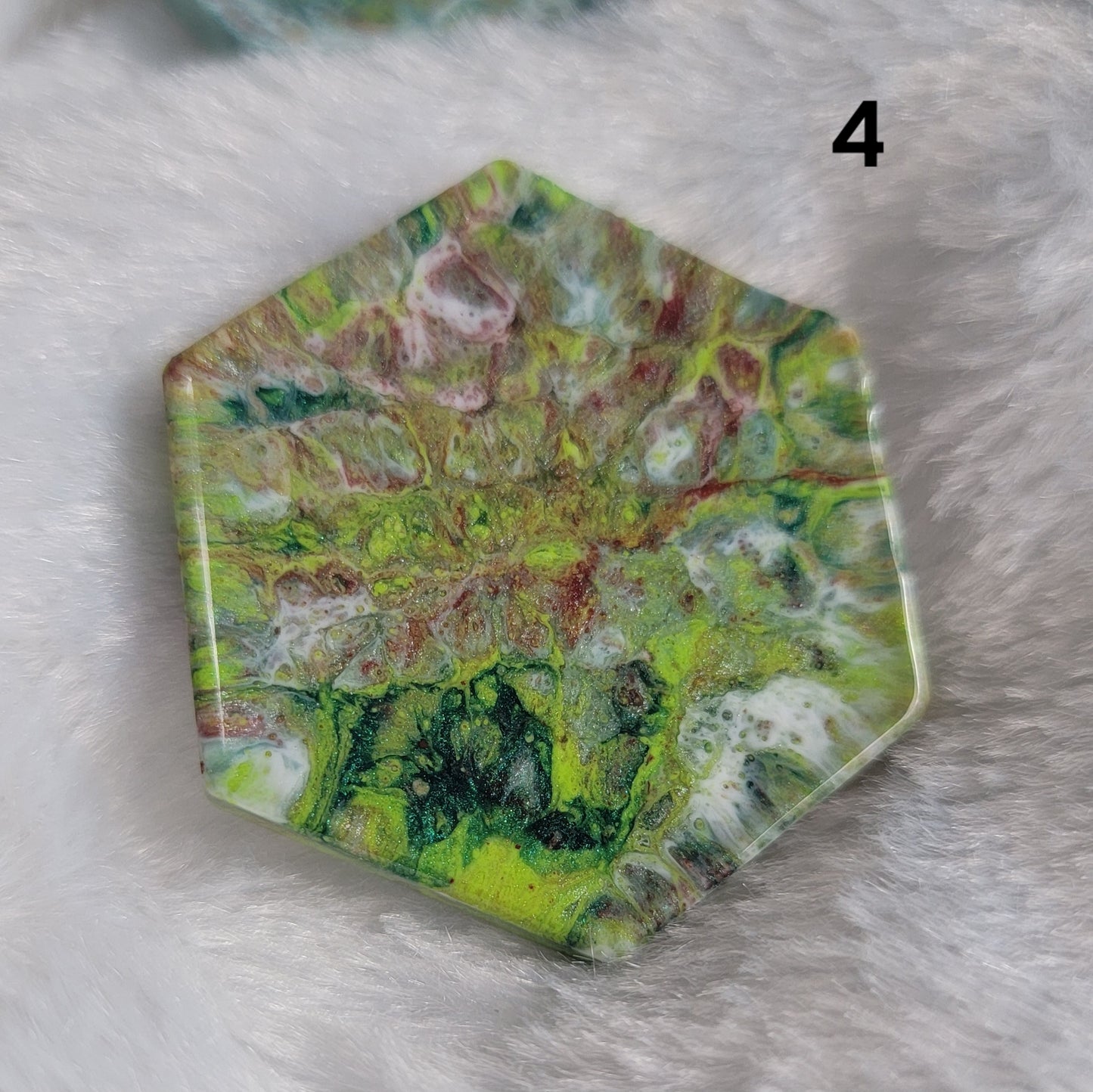 Hexagon shaped epoxy resin piece with swirling greens and rust colored pigments, displayed on a white background. The number "4" is in the top right corner.