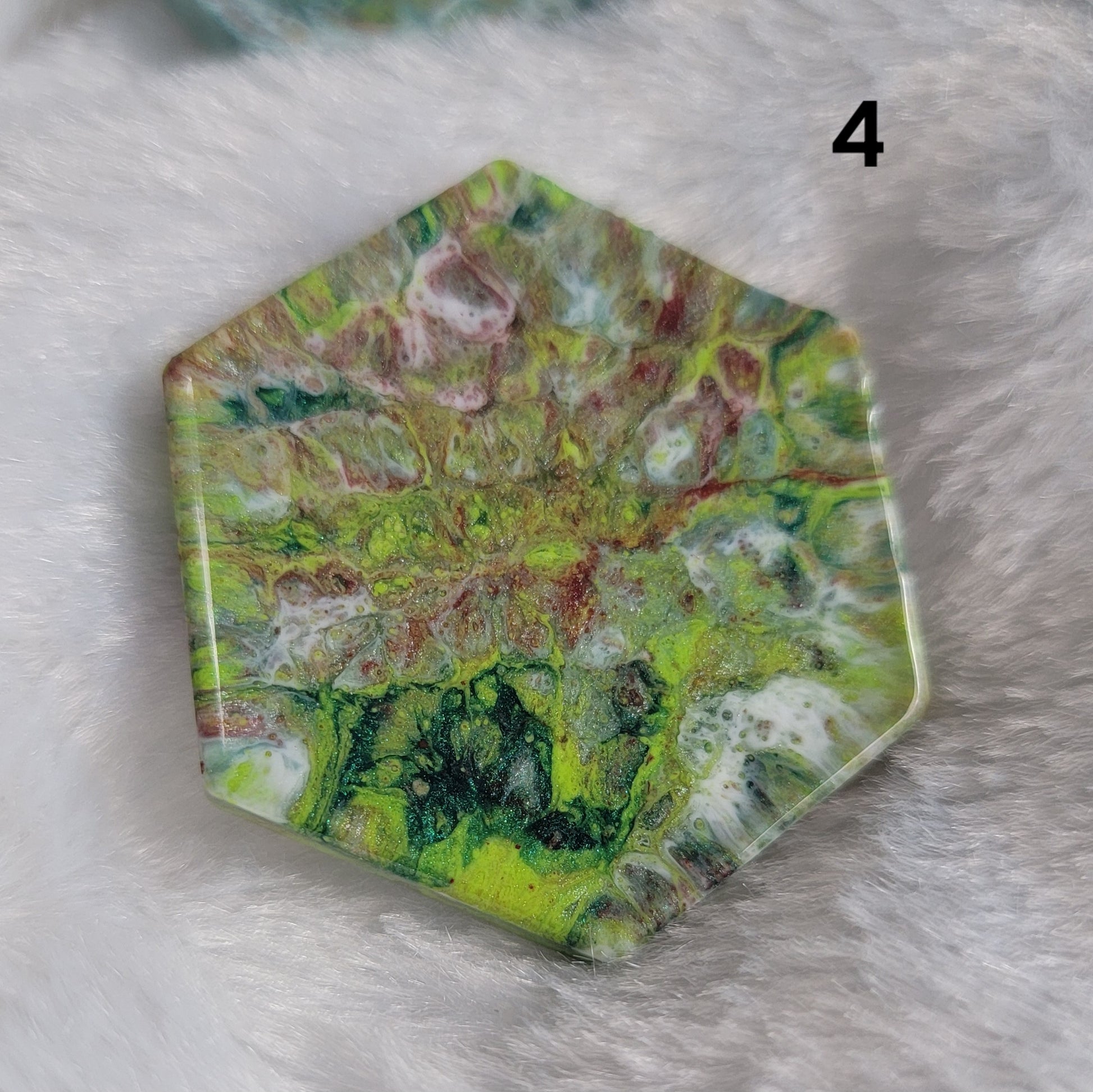 Hexagon shaped epoxy resin piece with swirling greens and rust colored pigments, displayed on a white background. The number "4" is in the top right corner.