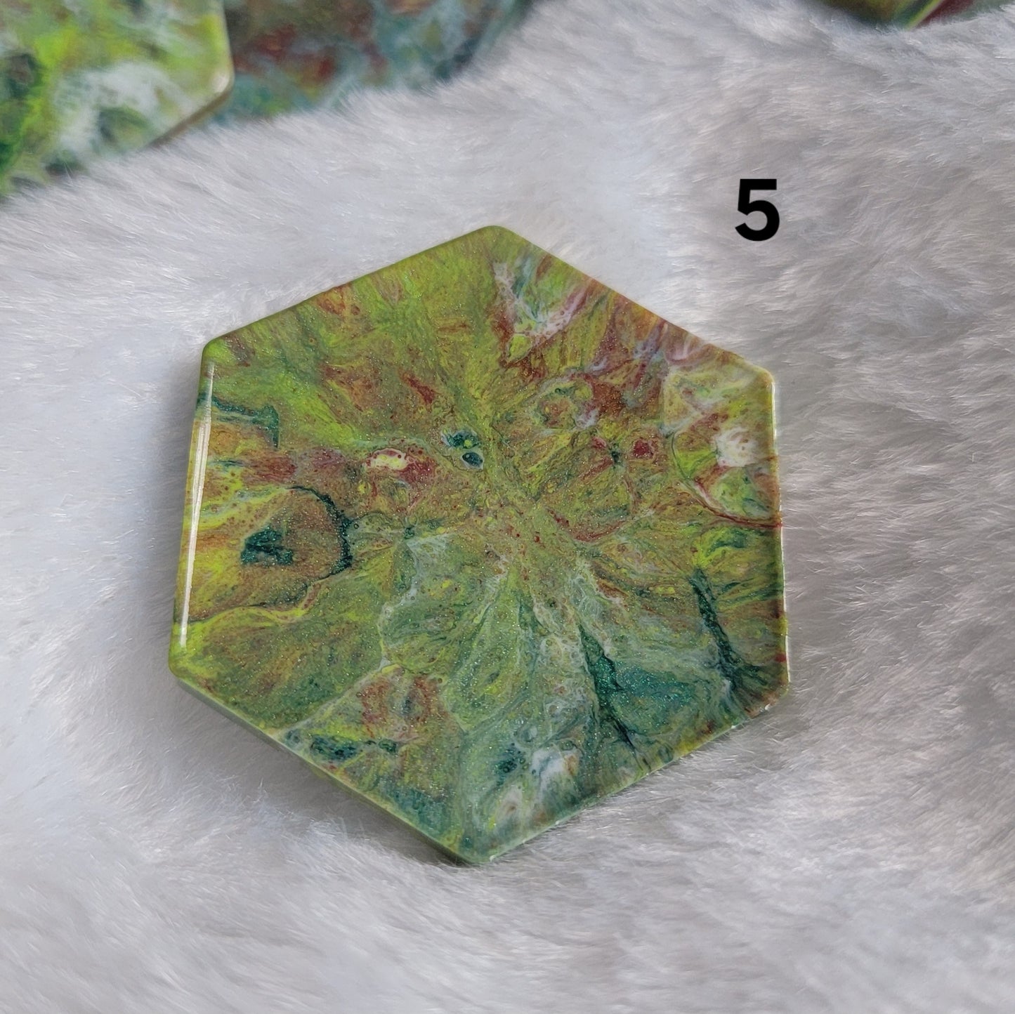 Hexagon shaped epoxy resin piece with swirling greens and rust colored pigments, displayed on a white background. The number "5" is in the top right corner.