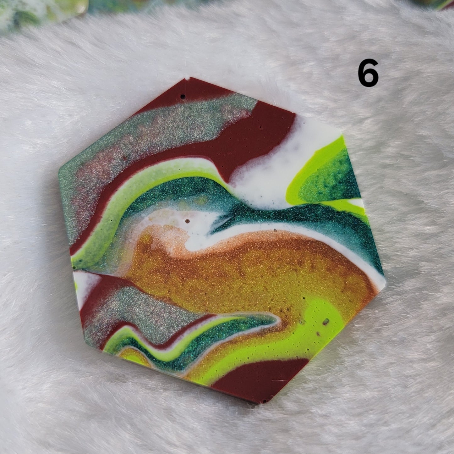 Hexagon shaped epoxy resin piece with swirling greens and rust colored pigments, displayed on a white background. The number "6" is in the top right corner.