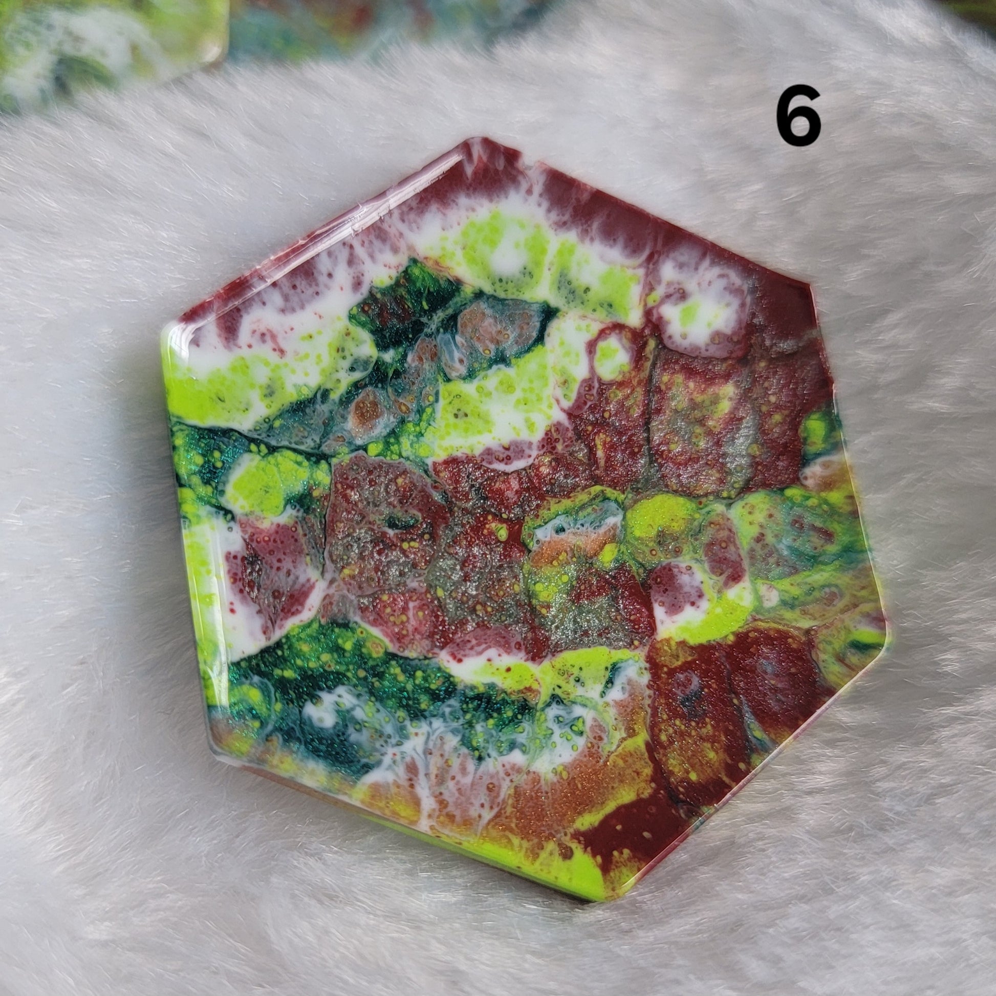 Hexagon shaped epoxy resin piece with swirling greens and rust colored pigments, displayed on a white background. The number "6" is in the top right corner.