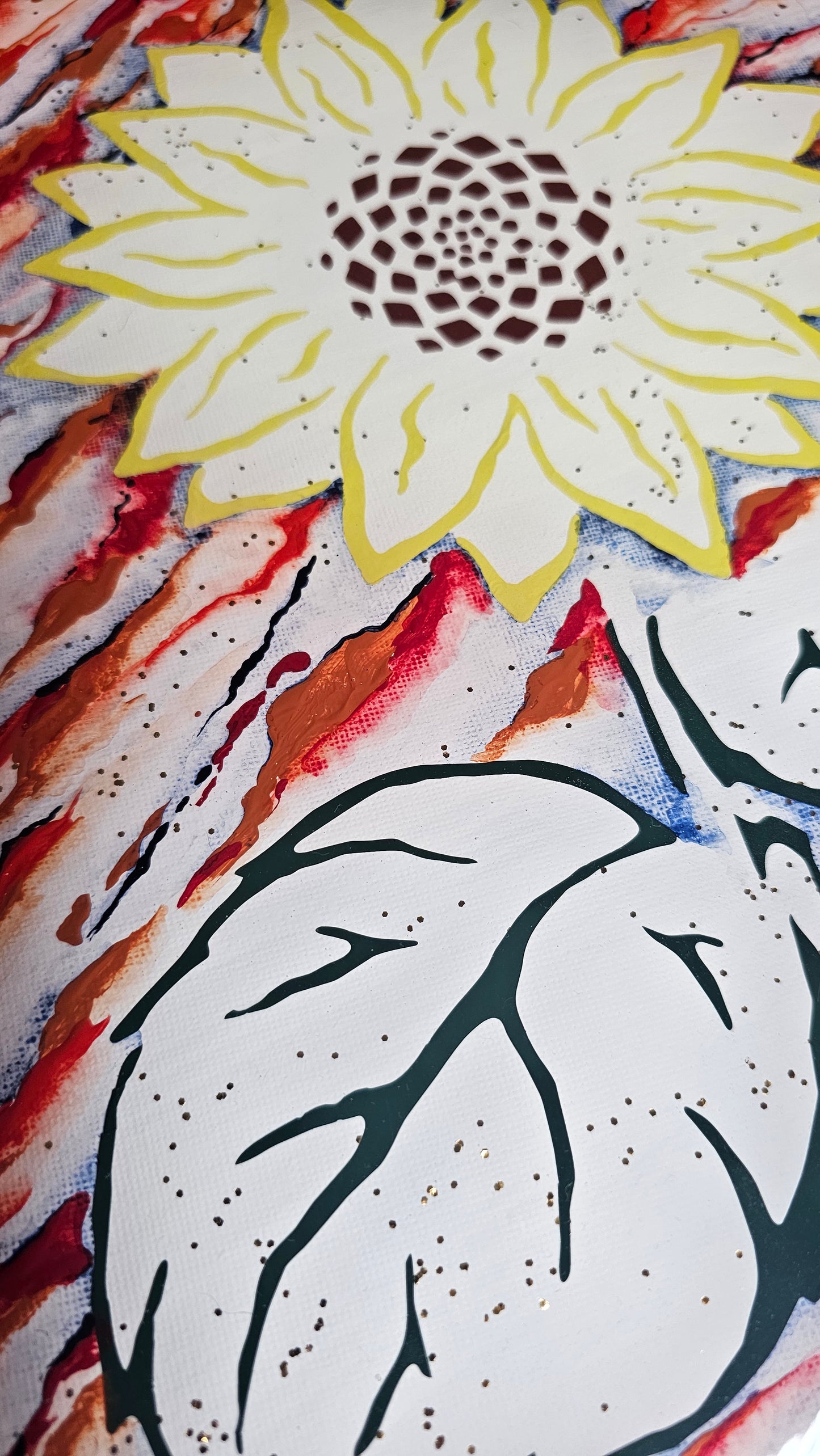 Close up of sunflower art made with yellow, green and brown vinyl, with rust and navy blue acrylic abstract painted background on white; accented with gold glitter and sealed in epoxy resin.