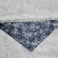 Bandana shown with measuring tape to show small size is 16.5", print is greyscale tree branches and bats.