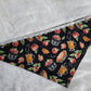 Bandana shown with measuring tape to show large size is 25.5", print is black with apples and apple treats like pies and cider.
